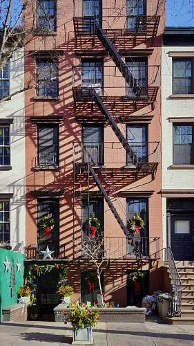 city architectural photography of brown and white house building